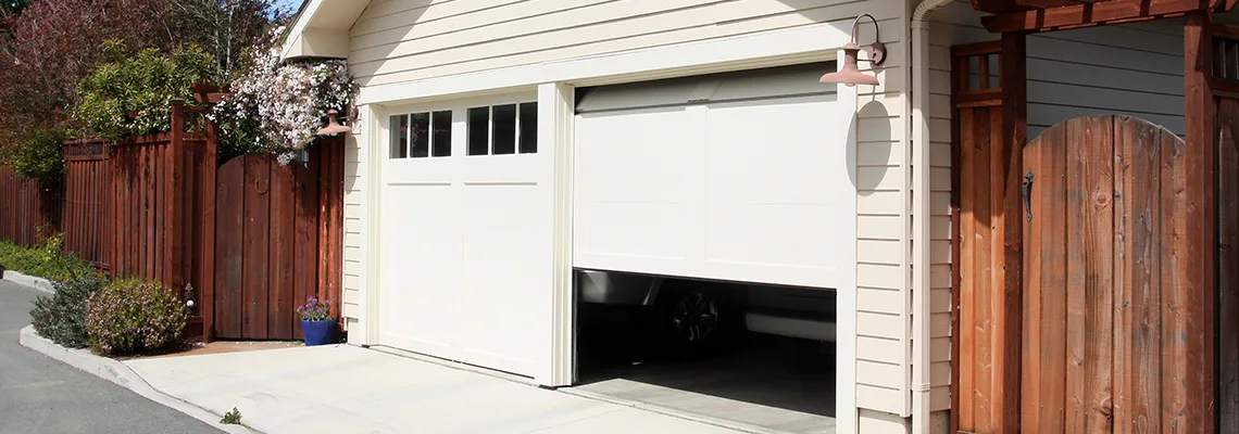 Fix Metal Garage Door Jerking in University, Florida